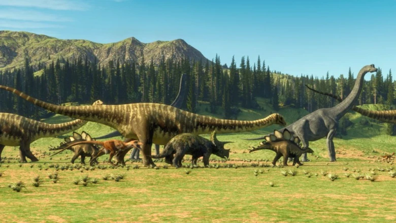 Skupina velkých dinosaurů na travnaté rovině s horami.