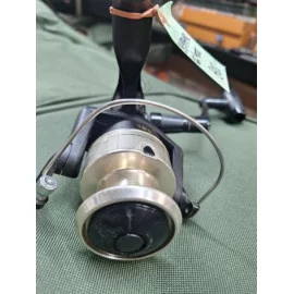 Fishing reel on green cloth